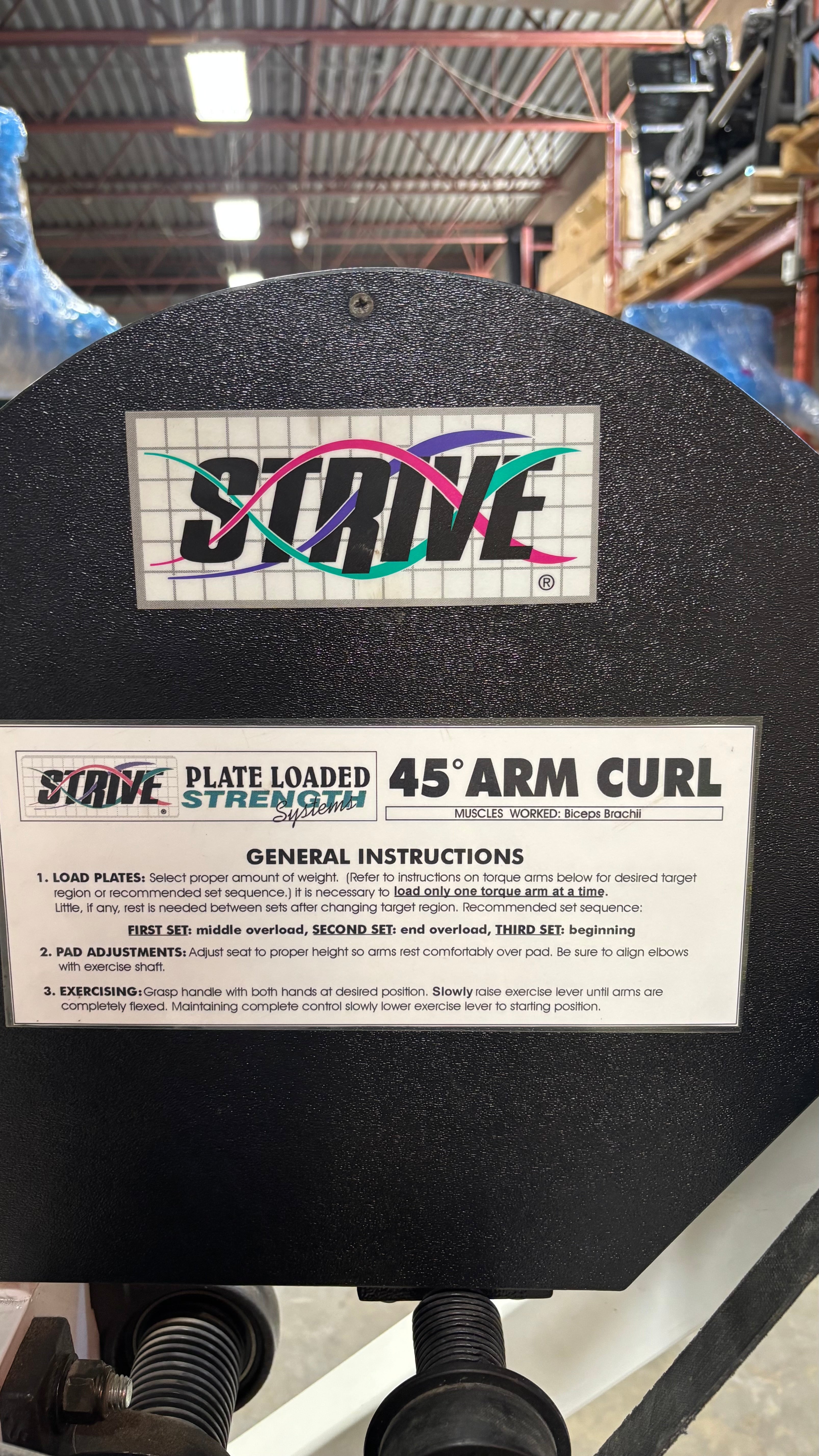Used Strive Plate Loaded Arm Curl