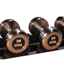 Close up of Intek Branded Kraft Steel Raw 30lb and 35lb Dumbbell on rack